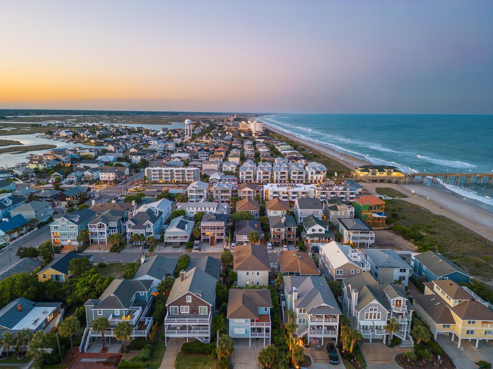 A beach town next to the water.